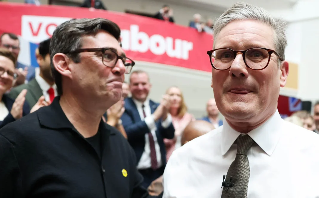 Mr Burnham (left) said it was a โdifficult decisionโ to put himself forward for the by-election Credit: Hollie Adams