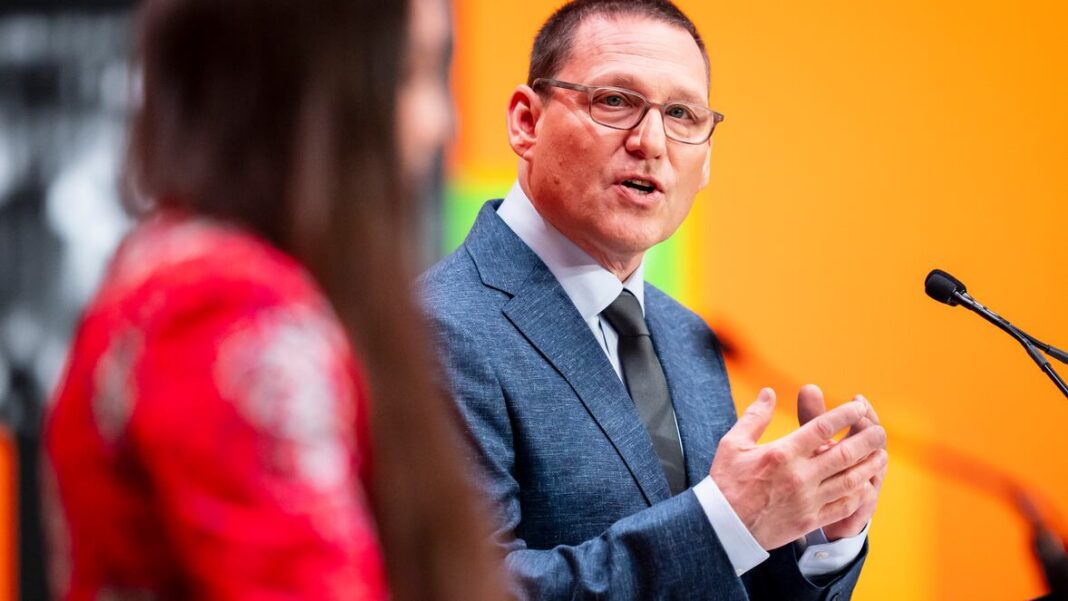 Avi Lewis speaks during the NDP leadership debate in Montreal on Nov. 27. This week he announced a 'humans first' policy around AI. (Christopher Katsarov/The Canadian Press)