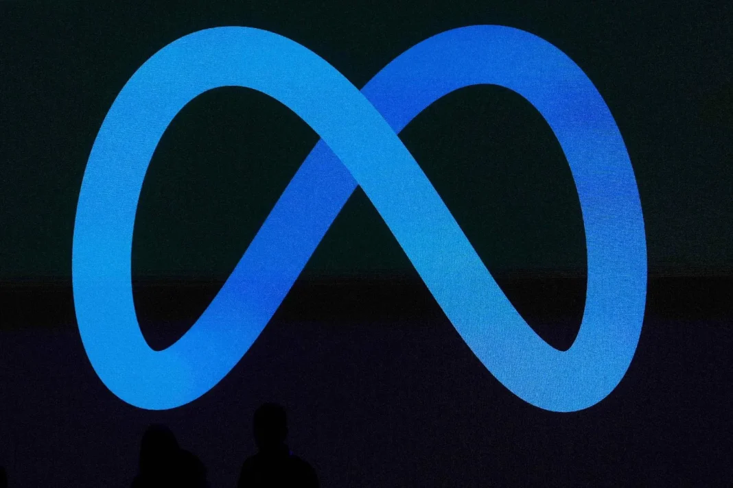 FILE -A Meta logo is shown on a video screen at LlamaCon 2025, an AI developer conference, in Menlo Park, Calif., April 29, 2025. (AP PhotoJeff Chiu, File)